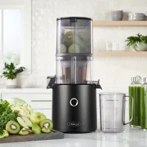 omega effortless juicer in black surrounded by fruits