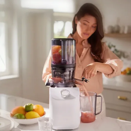 nama c2 juicer blender with woman juicing